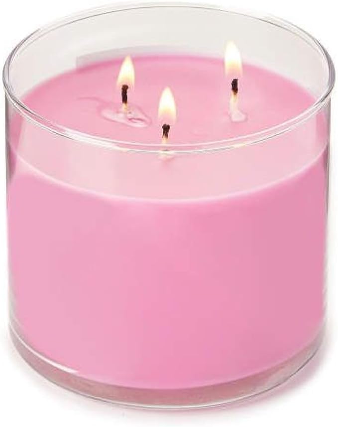 Pink three-wick candle in clear glass jar